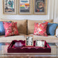 Large, red lacquer tray on a coffee table