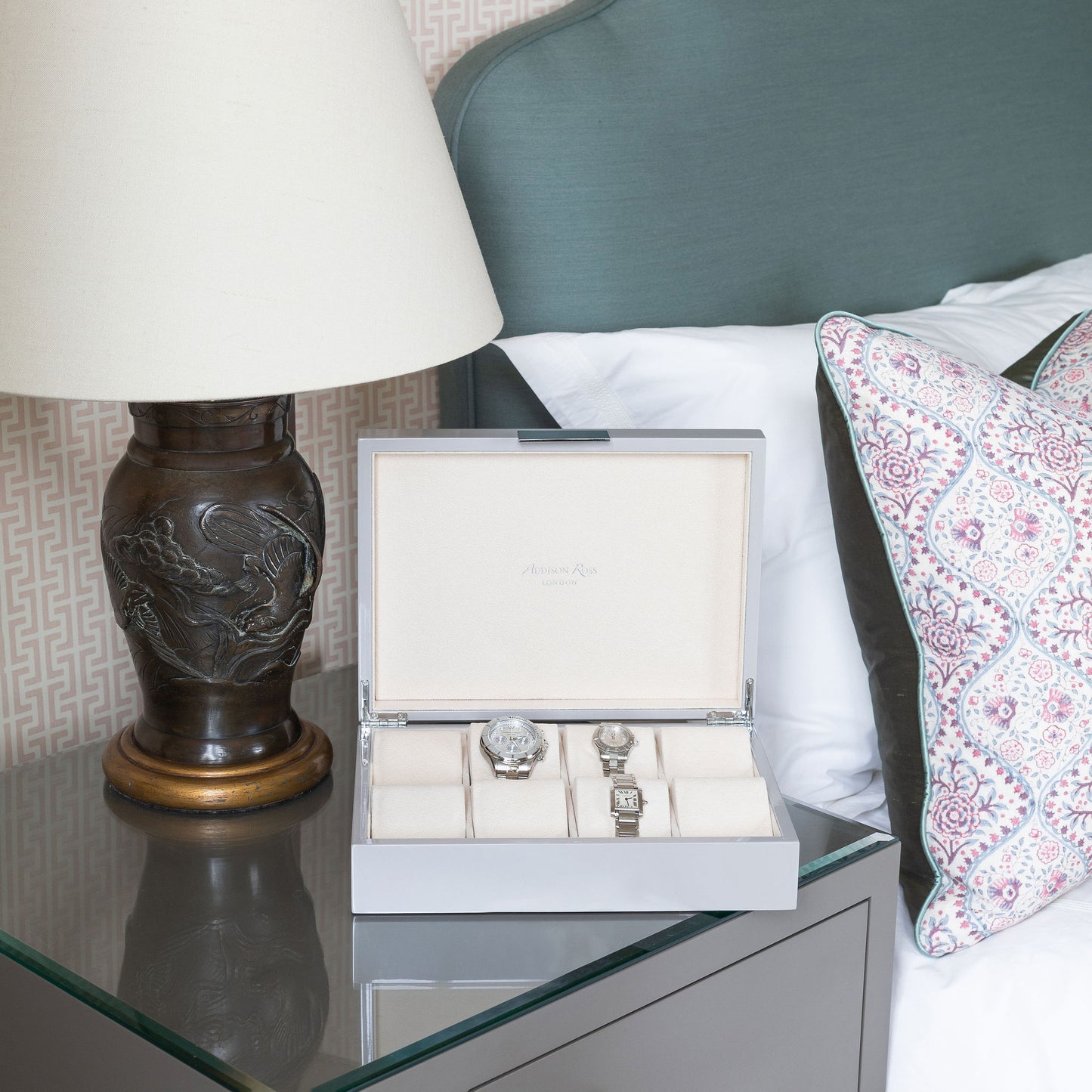 Large watch box on a bedside table