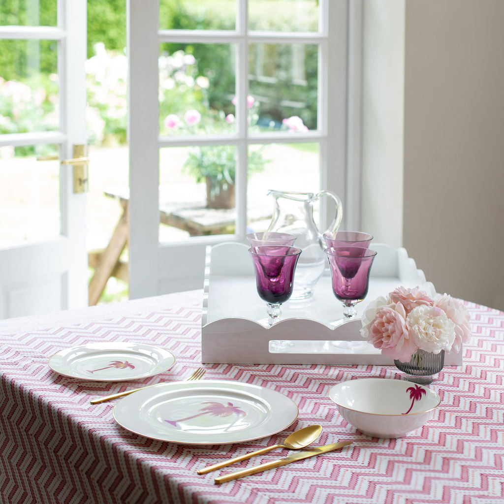 A large white lacquer tray on a dining table