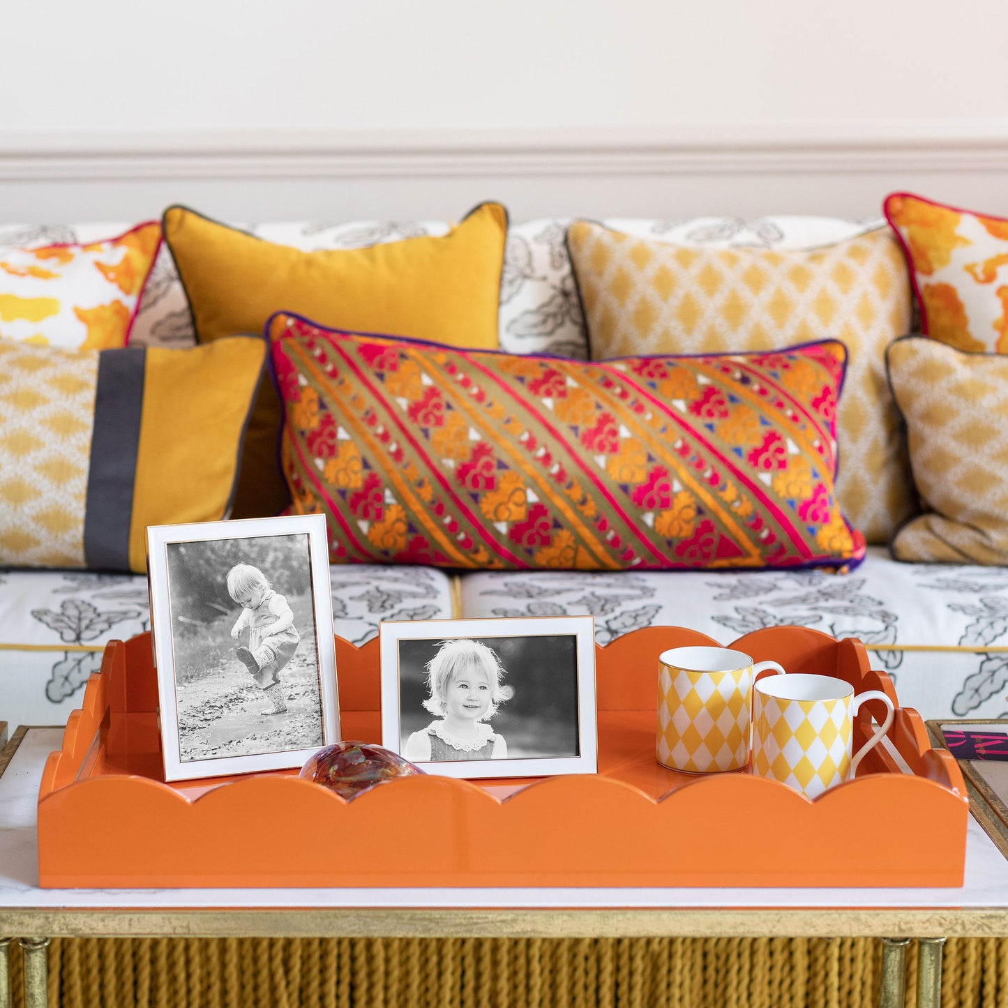 A pair of gold trim, white enamel photo frames