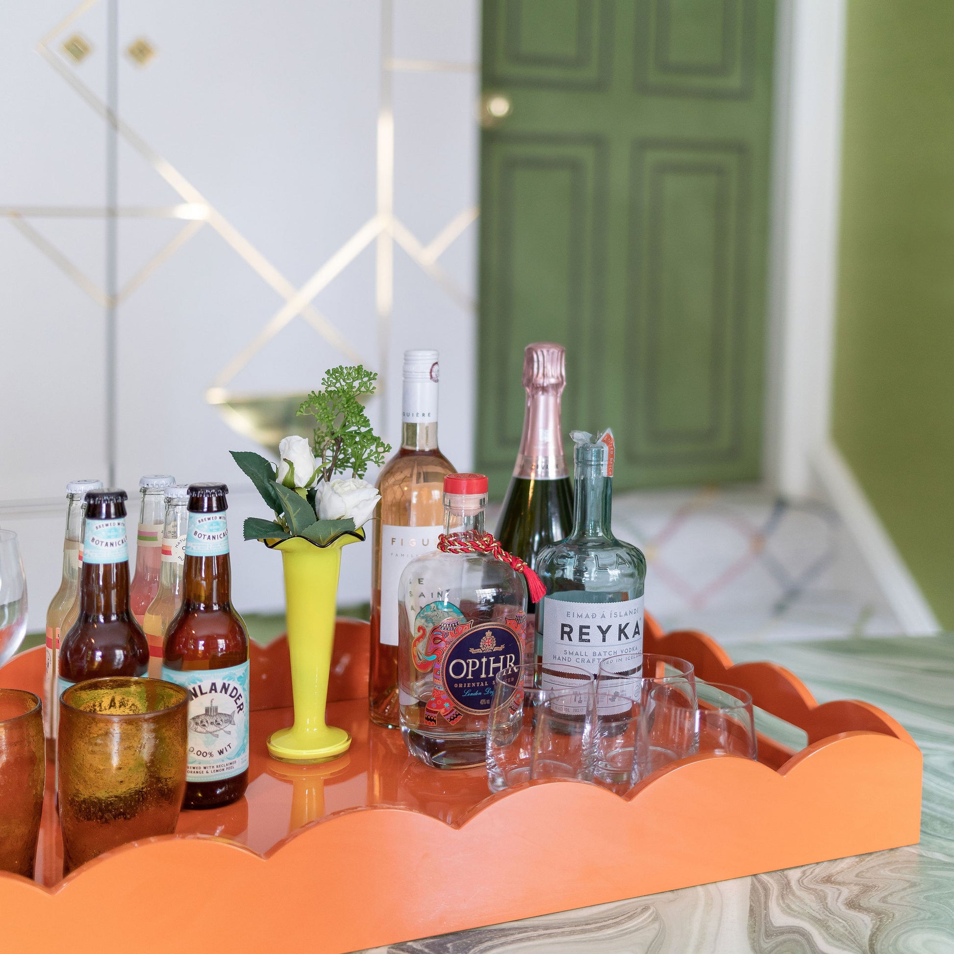 Drinks served on a large orange lacquer tray 