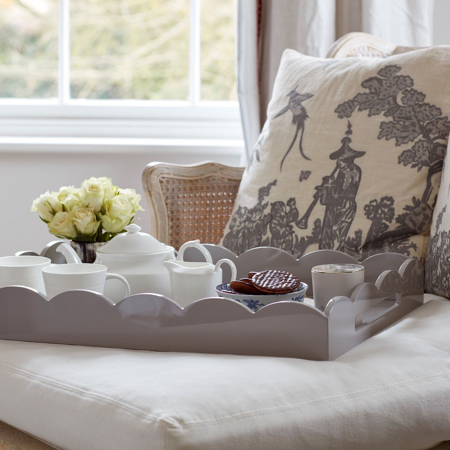 Tea cups on a large gray chiffon lacquer tray