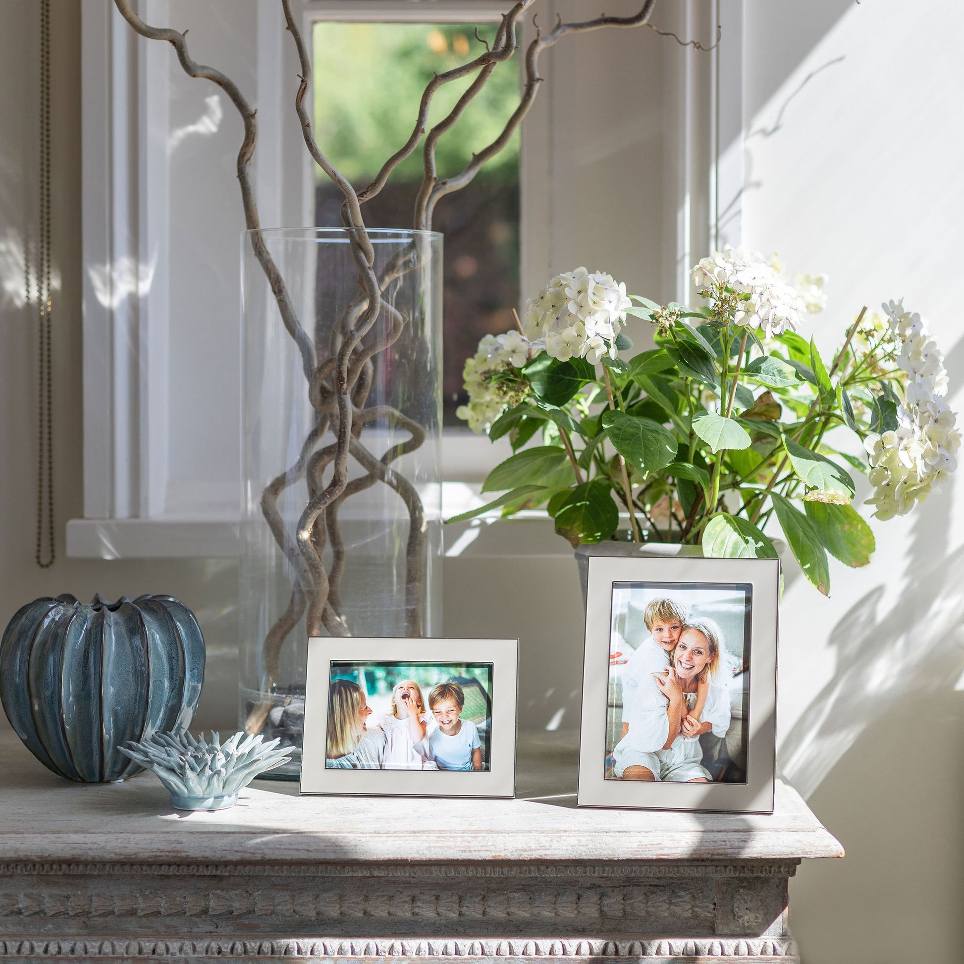 Two wide pebble enamel photo frames with silver trim