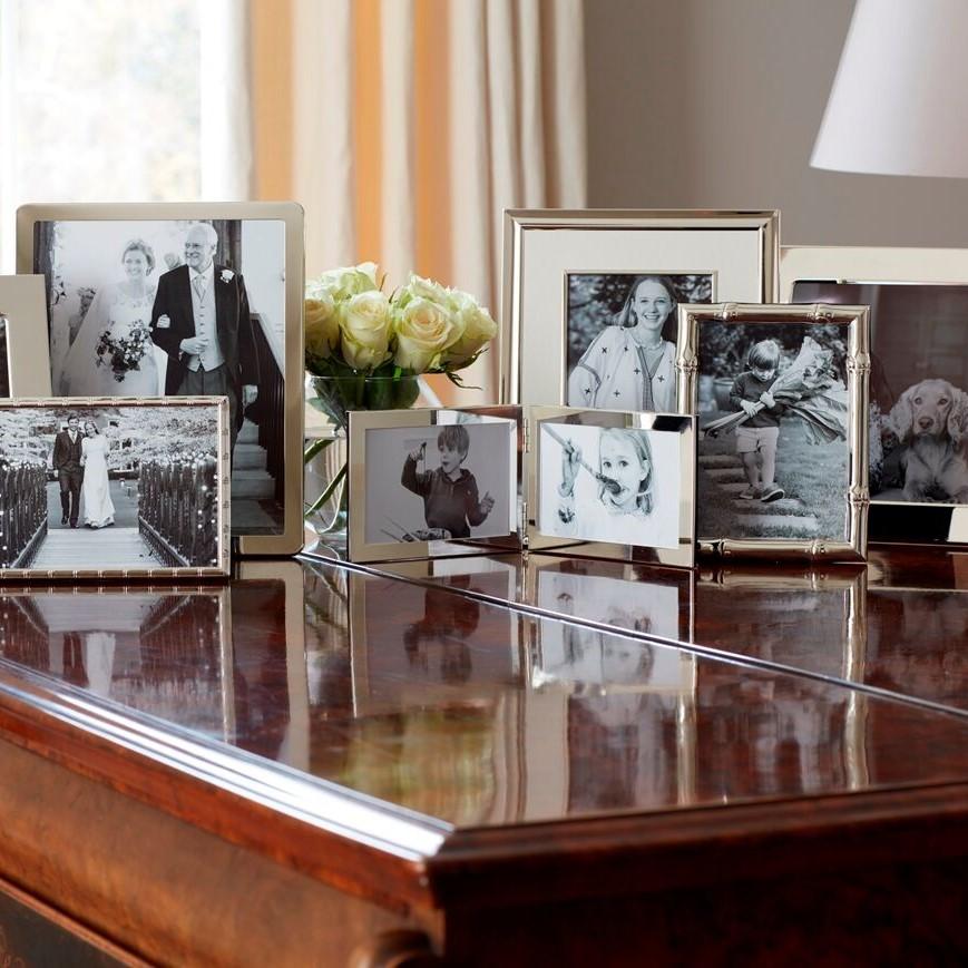 A collection of silver plated picture frames