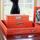 A stack of orange storage boxes